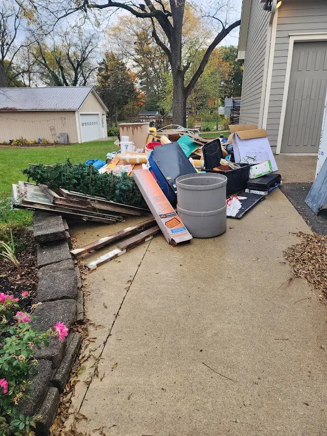 Dumpster being loaded with debris for 10 Yard Dumpster Rental in Salem